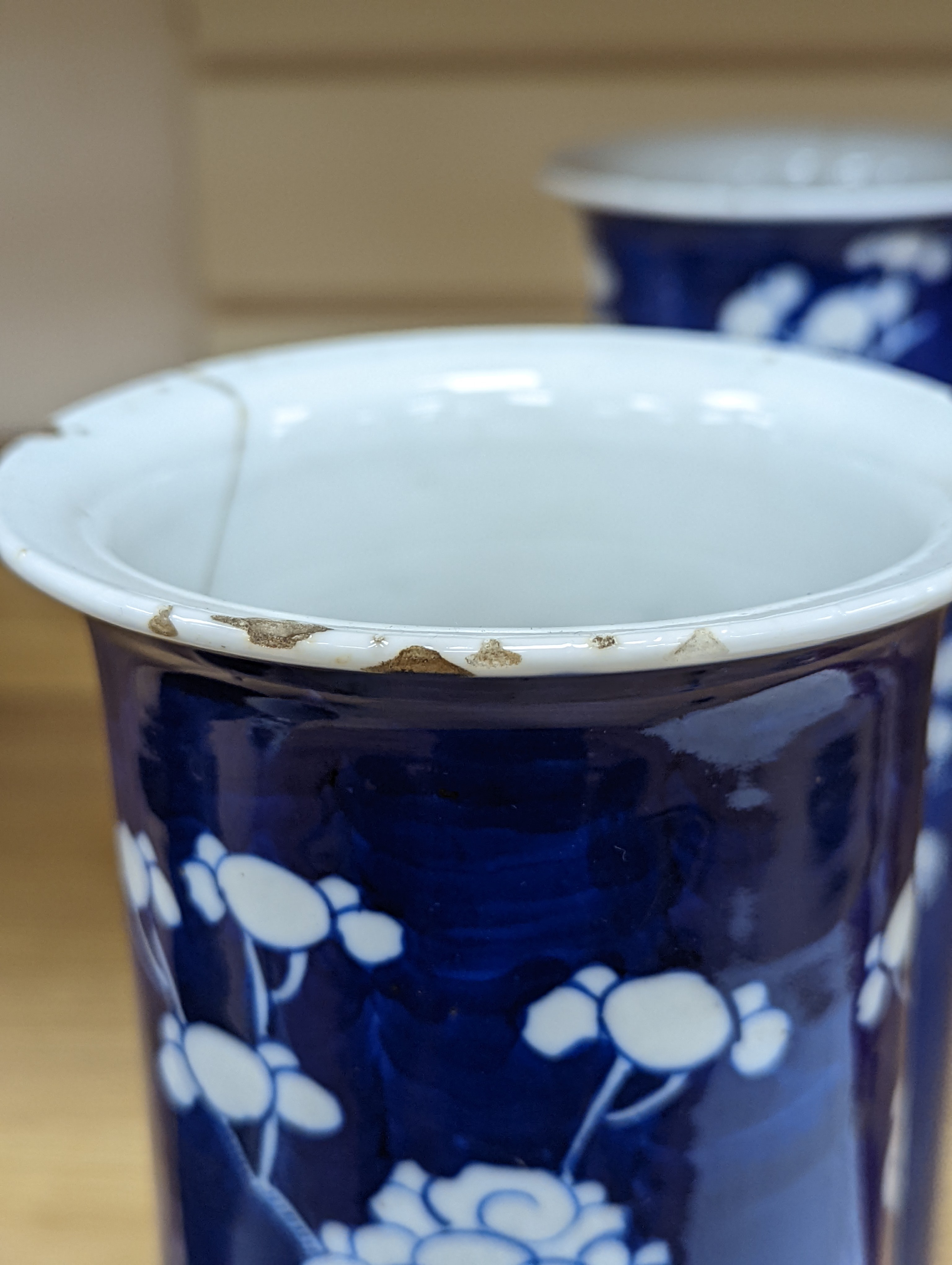 An 18th century Chinese famille rose mug, a Chinese Imari tea caddy and two Chinese blue and white sleeve vases 30cm (4)